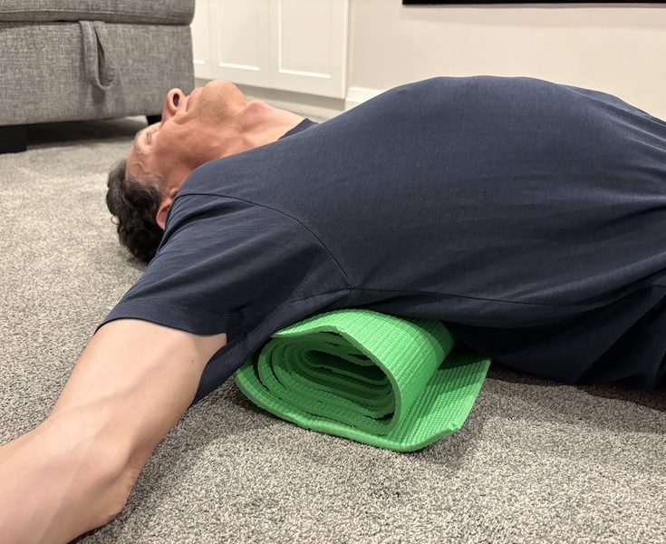 Starting position for thoracic spine traction exercise to improve mid-back posture.