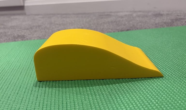 Specialized thoracic traction wedge used in Toronto chiropractic posture correction.